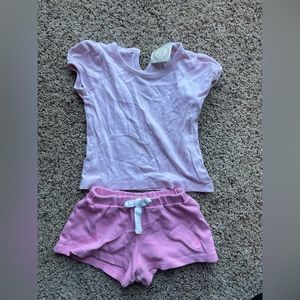The top is a 2t and bottoms fit like a 2t